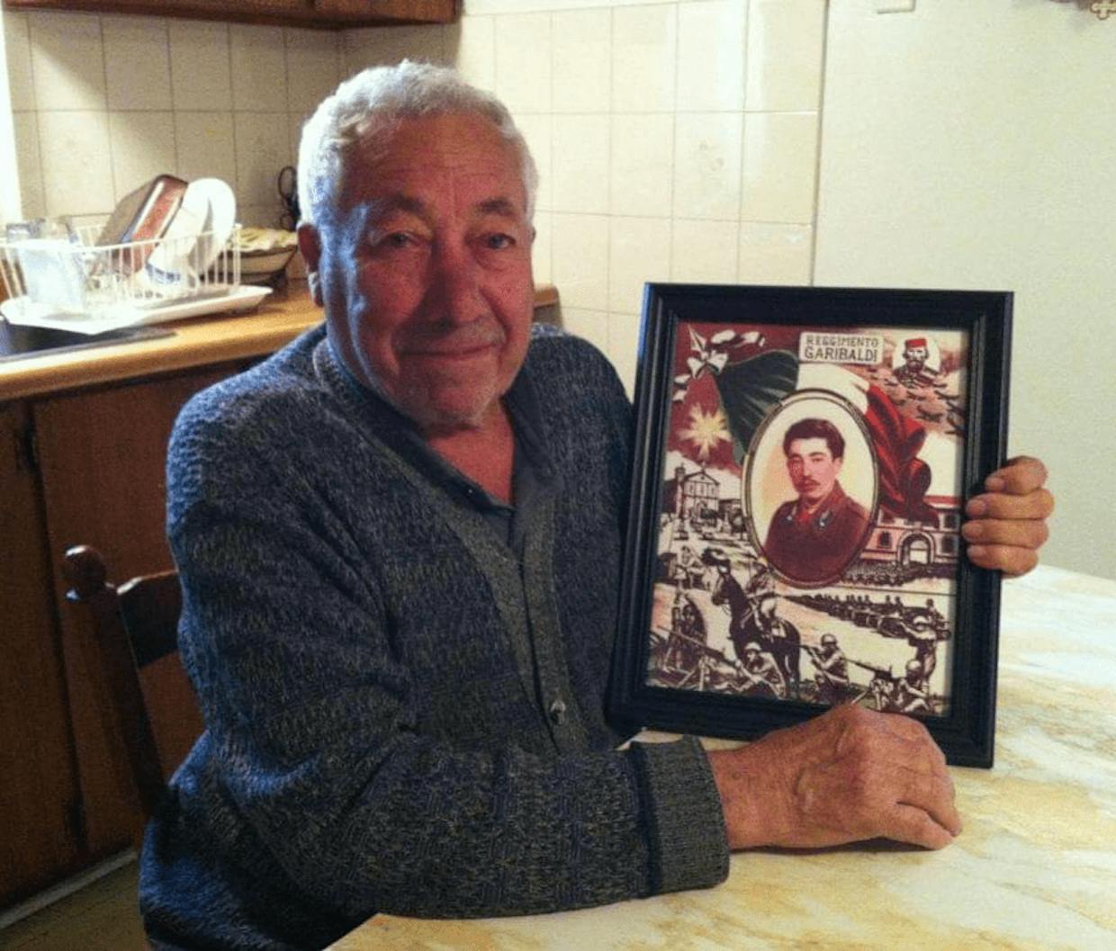 My dad with an enlarged photo of him at 20 years old when he was in the Reggimento  Bersagliero "GaribaldI" in Venice, Italy. He was SO excited when my son (his grandson) surprised him with this ❤