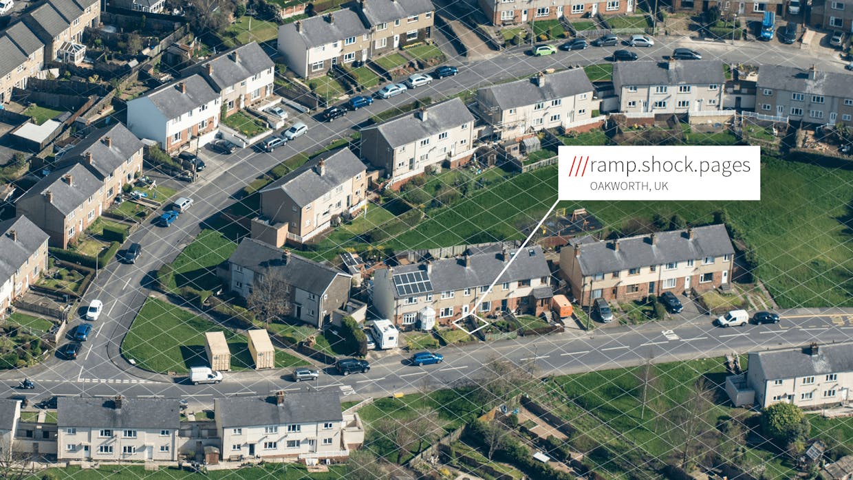 Aerial view of residential estate, one house addressed ///ramp.shock.pages