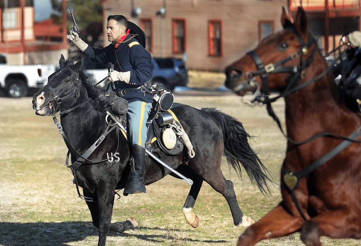 Outgoing Commander Maj. Eduardo Gonzalez performs his final charge up Brown Parade Field as the B Troop, 4th U.S. Cavalry Regiment (Memorial) leader during last Friday’s change of command event.