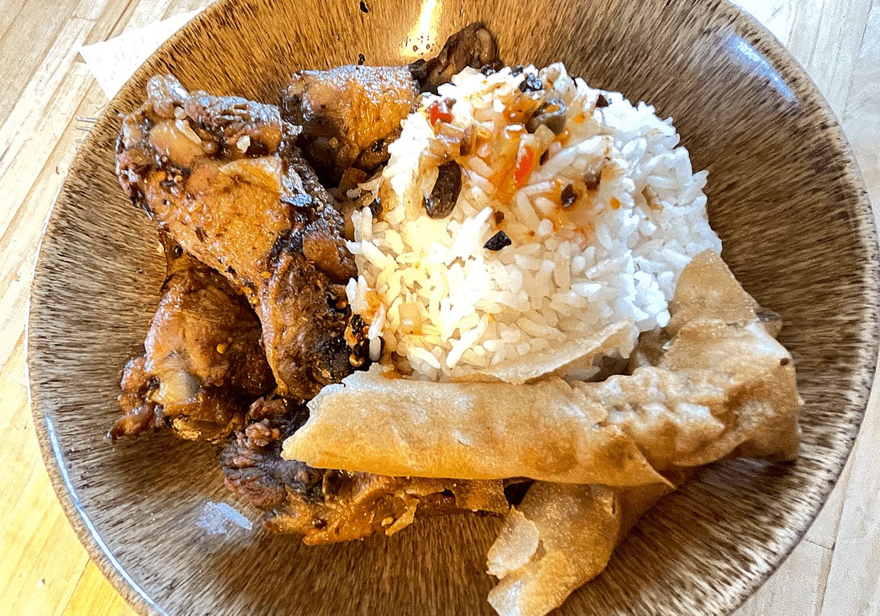 Adobo chicken wings with lumpia and white rice. 