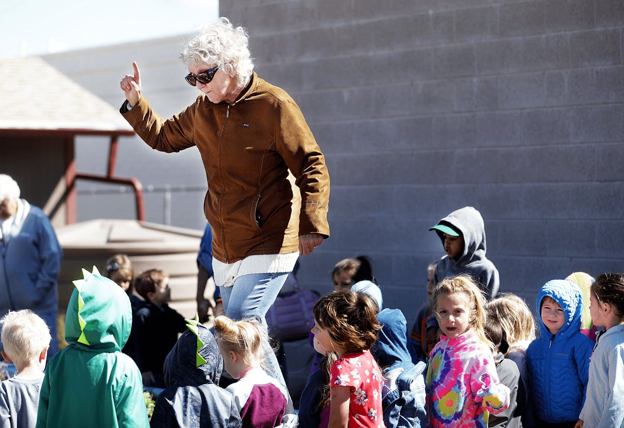  Rebecca Hillebrand, a founding member of the Sierra Vista Community Garden, talks with preschoolers Wednesday at the Willcox Drive garden. The garden is celebrating their 10th year and is renamed the Cynthia Newlon Community Garden.