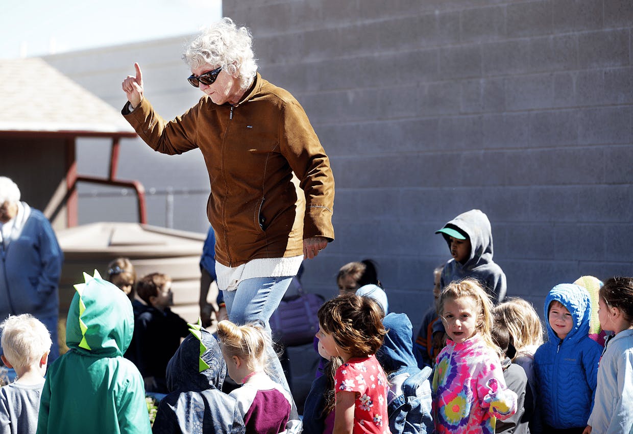 Â Rebecca Hillebrand, a founding member of the Sierra Vista Community Garden, talks with preschoolers Wednesday at the Willcox Drive garden. The garden is celebrating their 10th year and is renamed the Cynthia Newlon Community Garden.
