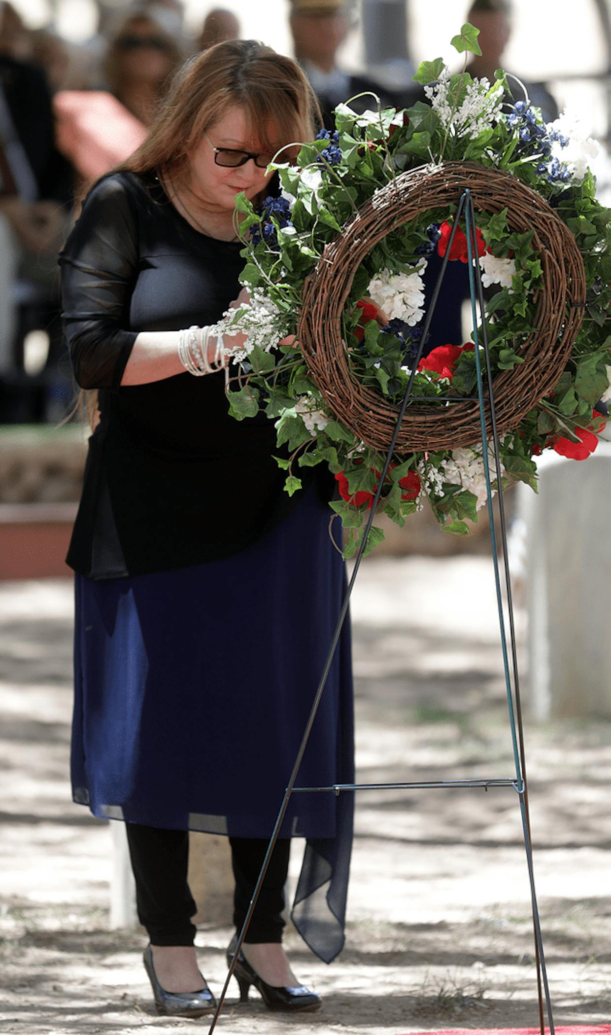 Gold Star mother Lorraine Obregon lays a wreath for her son Pvt. Stefano Panchesin during Monday’s annual Memorial Day ceremony in Fort Huachuca’s post cemetery.