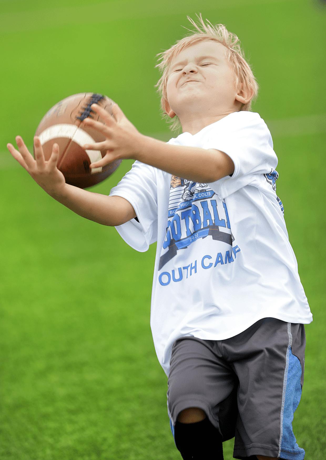 Saturday Buena High School head football coach Joe Thomas hosted a free youth football camp at Cyr Field with several of his coaches and players. Five-year-old Erik Justesen gives it his all at this weekend’s camp.