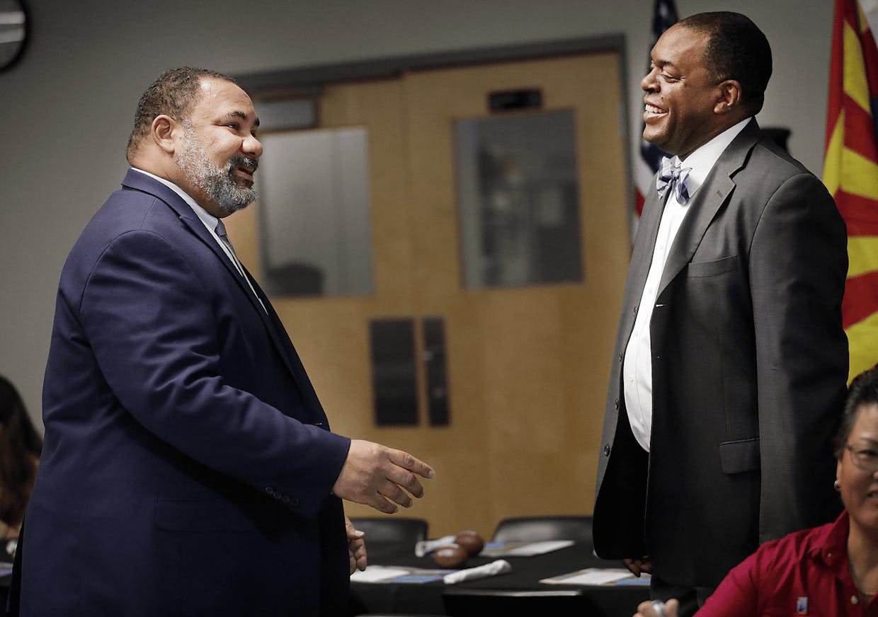 Sierra Vista Unified School District Superintendent Eric Holmes, left, chats with Clea McCaa during the yearly Spotlight Breakfast on the Sierra Vista campus of Cochise College this week.