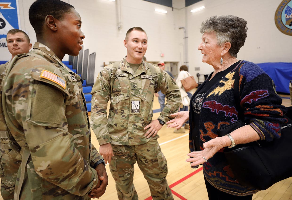 Over 80 soldiers showed up at Eifler Gymnasium on Fort Huachuca Tuesday evening for the annual Soldiers for Thanksgiving Day adopt-a-soldier event. Pvt. Jordan Potter, left, and Pfc. Connor Keenan interact with Grandma Orsi as she tells them what Thanksgiving delectables she will be serving to them on the big day.
