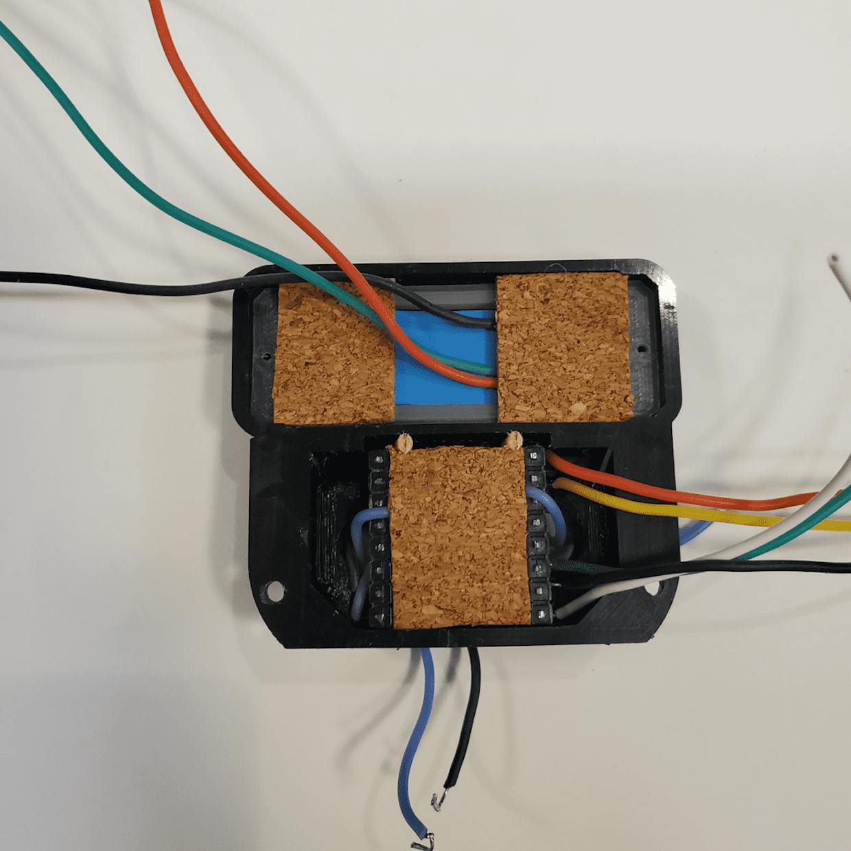 Adhesive cork installed on Neo pixel and DF mini before buttons were soldered