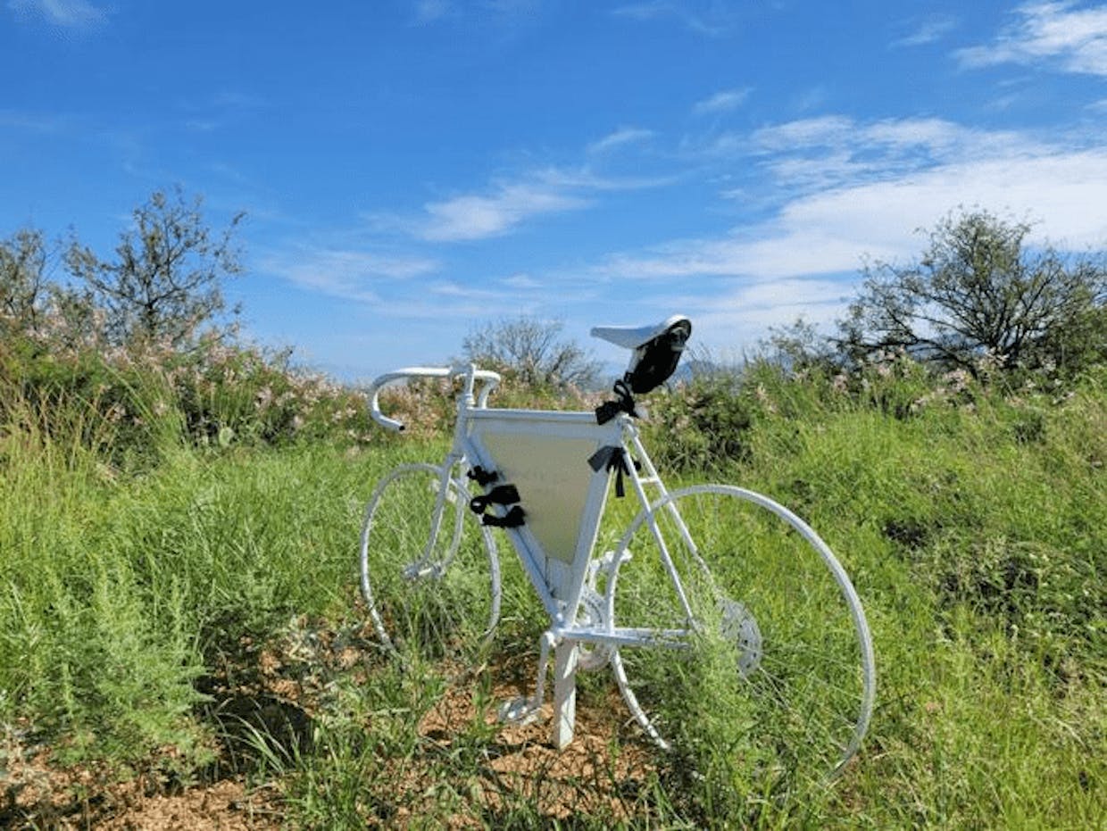 A ghost bike marks the entrance to Coronado National Forest along Madera Canyon Road in memory of  George “Fred” Dillemuth, a Sahuarita resident. (Amy Dillemuth photo)