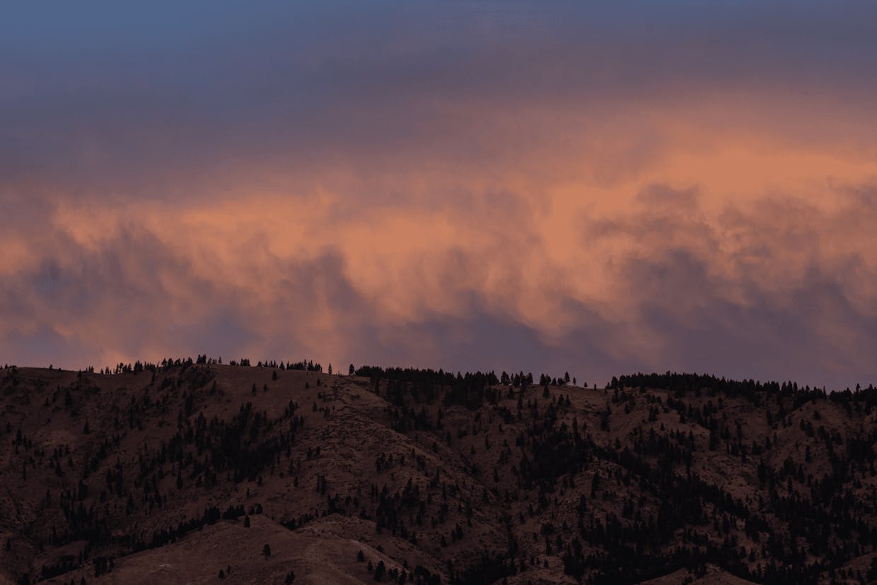 Clouds reflect the sunset above hills northeast of Cashmere, Sept. 30 along the Nahahum Canyon Road.