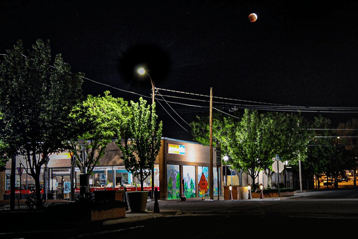 View of the Super Flower Blood Moon on May 15, just after 9 p.m., near the Old City Market