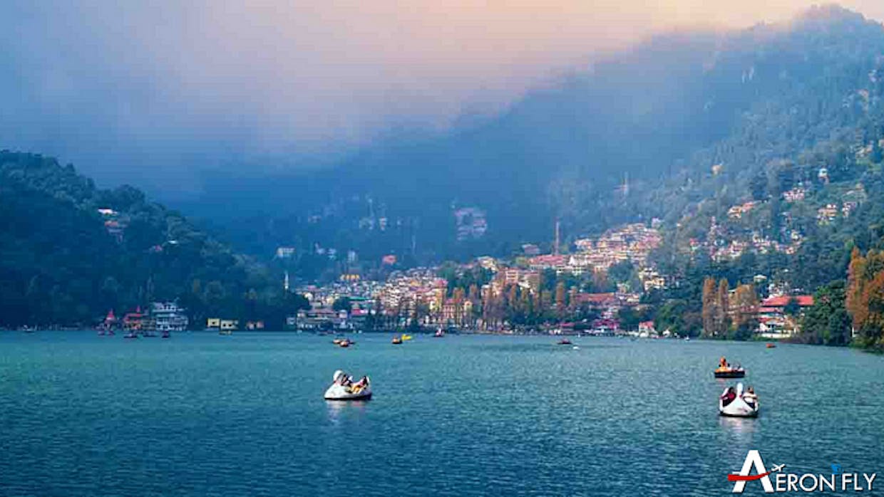 What are the top tourist attractions in Nainital and how can visitors make the most of their trip to this scenic hill station in India.