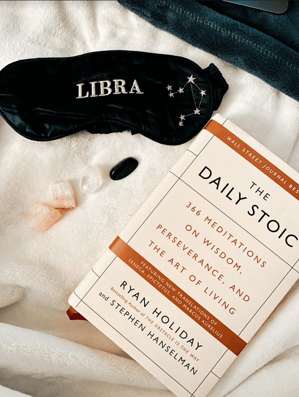 Morning essentials: remove eye mask, read the Daily Stoic, receive good energy from my crystals